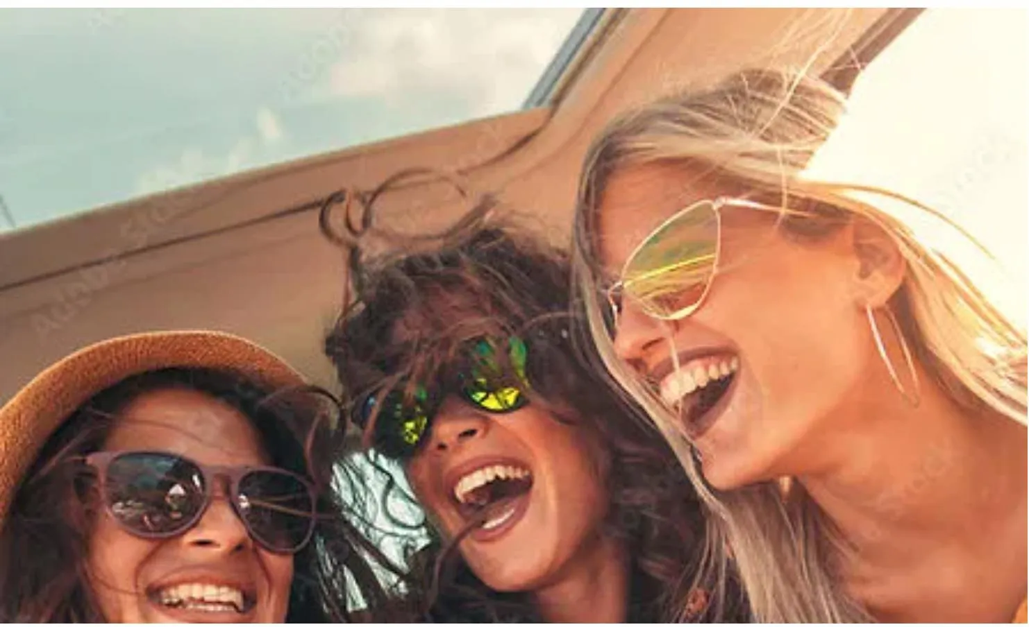 Friends laughing together in the sunshine